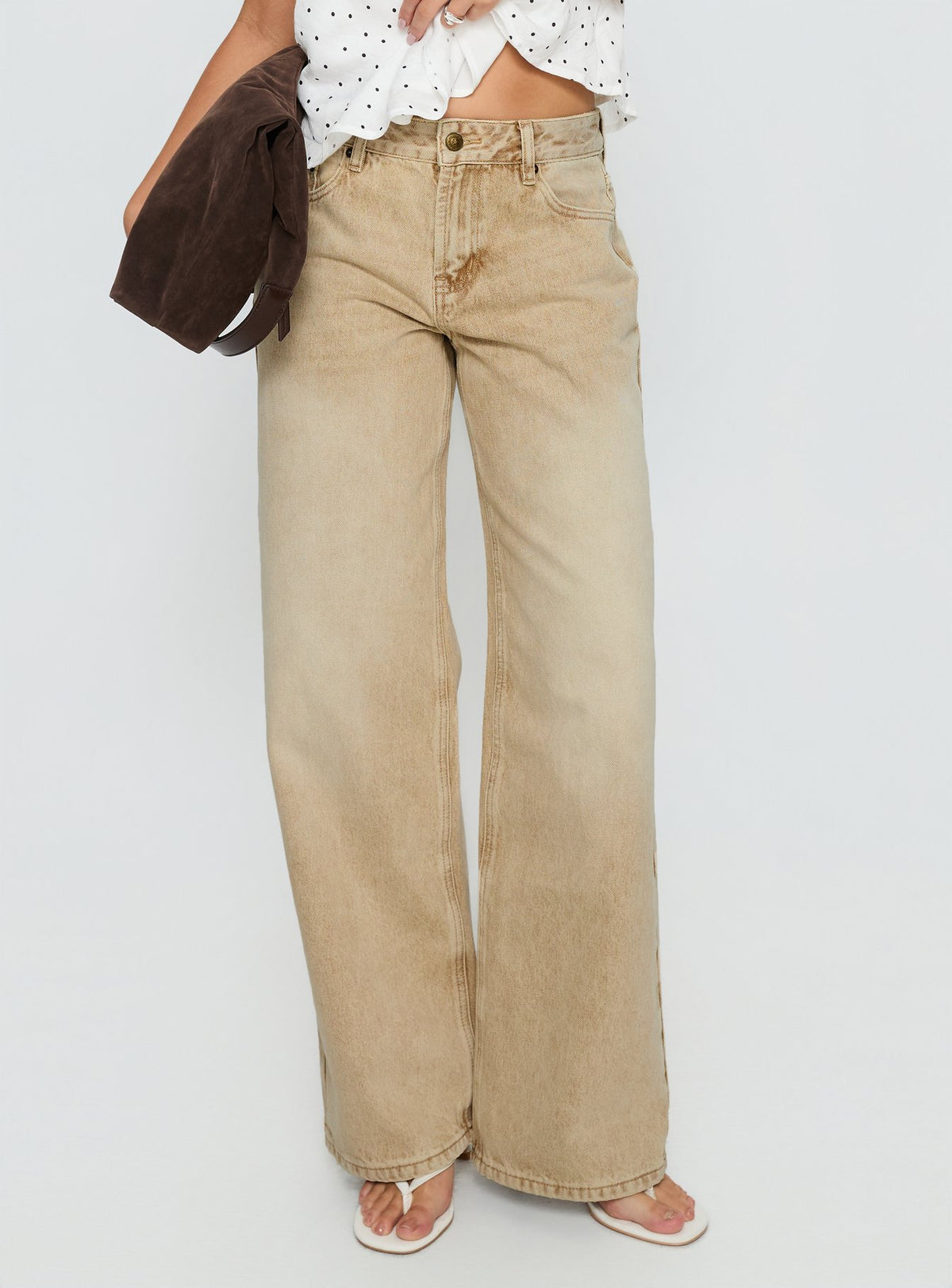 side view of model wearing Princess Polly Serenitia Mid Rise Relaxed Jeans Sandy Brown Wash Mid Rise Jeans 