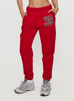 front view of model wearing Princess Polly BU Sweatpants Red High Rise Pants Pants 