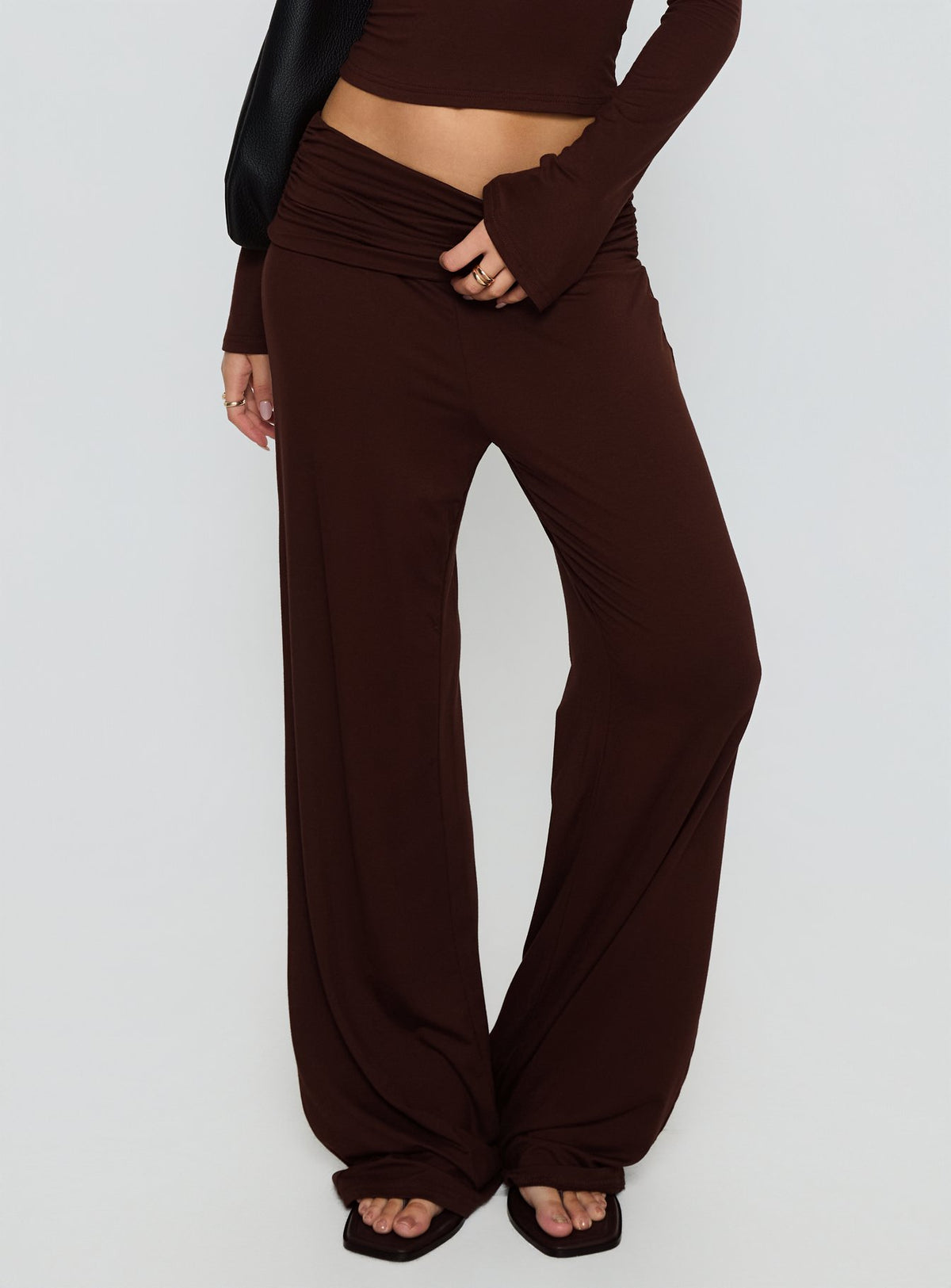 side view of model wearing Princess Polly Fawne Ruched Folded Pants Brown Mid Rise Pants Pants 