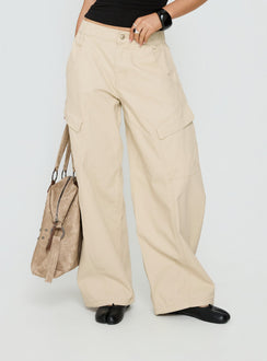 side view of model wearing Princess Polly Selective Memory Low Rise Wide Leg Cargo Pants Cream Low Rise Pants Pants 