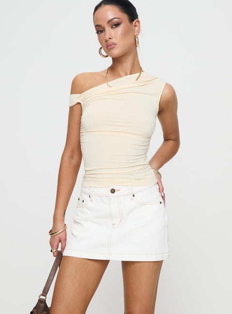Crafted with the Nicolina Low Rise Denim Mini Skirt Ecru Tall womens-skirts in mini length front view of model wearing Princess Polly
