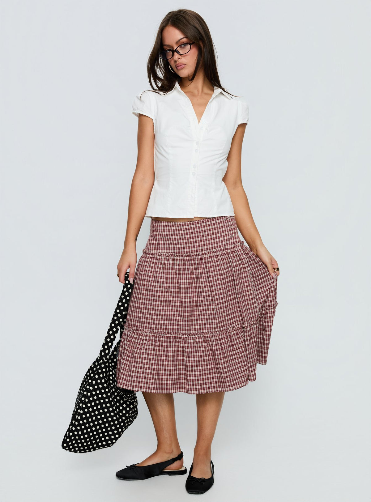   side view of model wearing Princess Polly Cascades Low Rise Midi Skirt Red Check Midi Skirts Skirts 