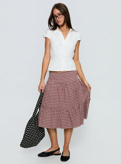   side view of model wearing Princess Polly Cascades Low Rise Midi Skirt Red Check Midi Skirts Skirts 