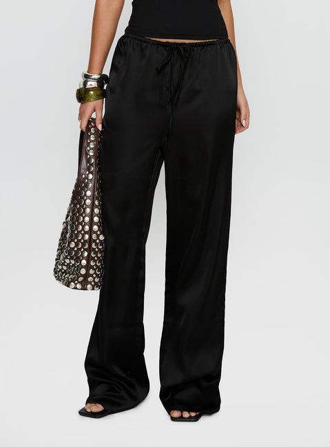 side view of model wearing Princess Polly Soulstar Satin Pants Black High Rise Pants Pants 