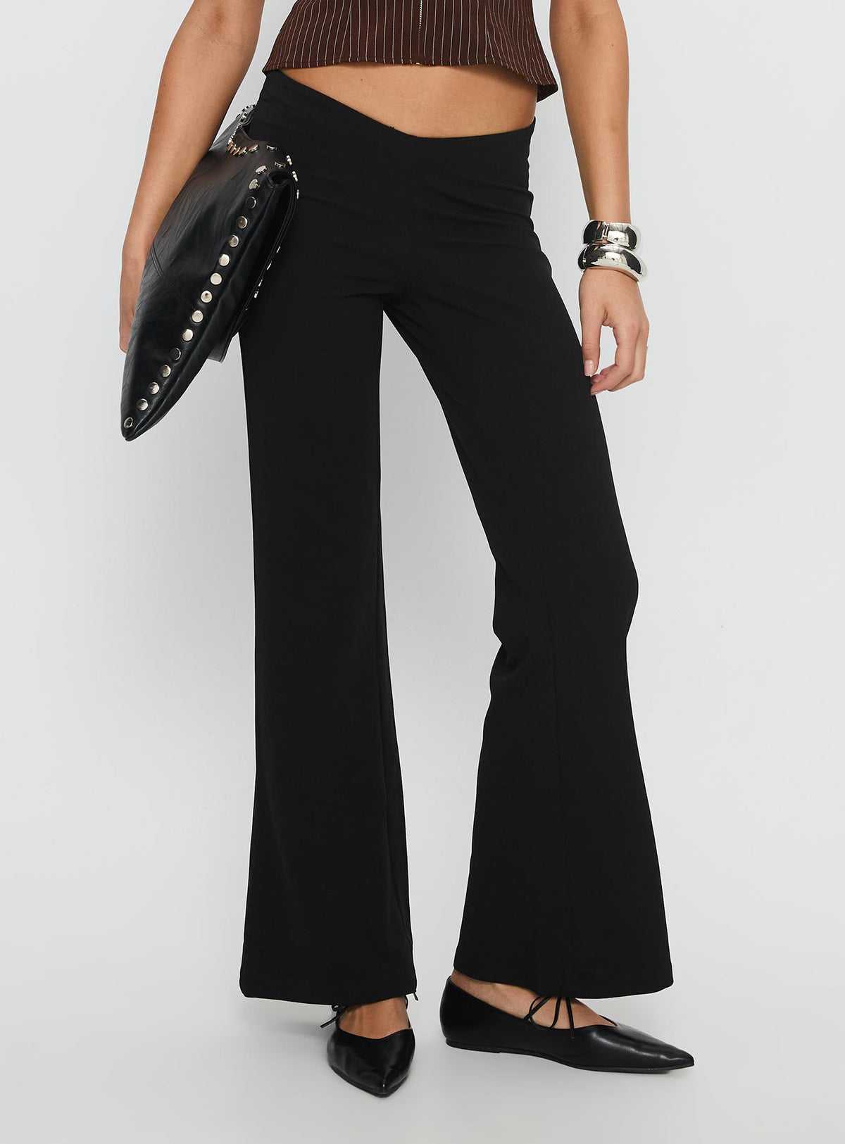 front view of model wearing Princess Polly Showstopper V-Front Pant Black Low Rise Pants 