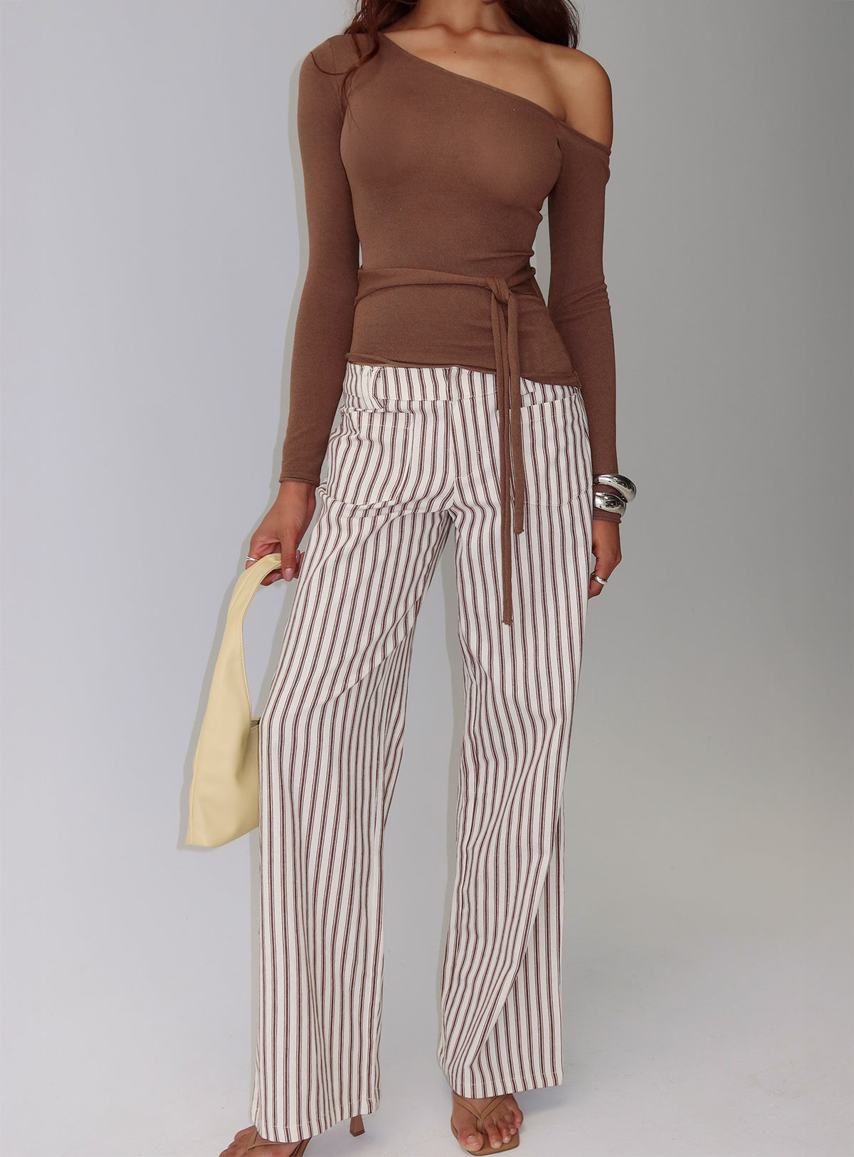 back view of model wearing Princess Polly Vendi Low Rise Pant Brown Stripe Low Rise Pants Pants 
