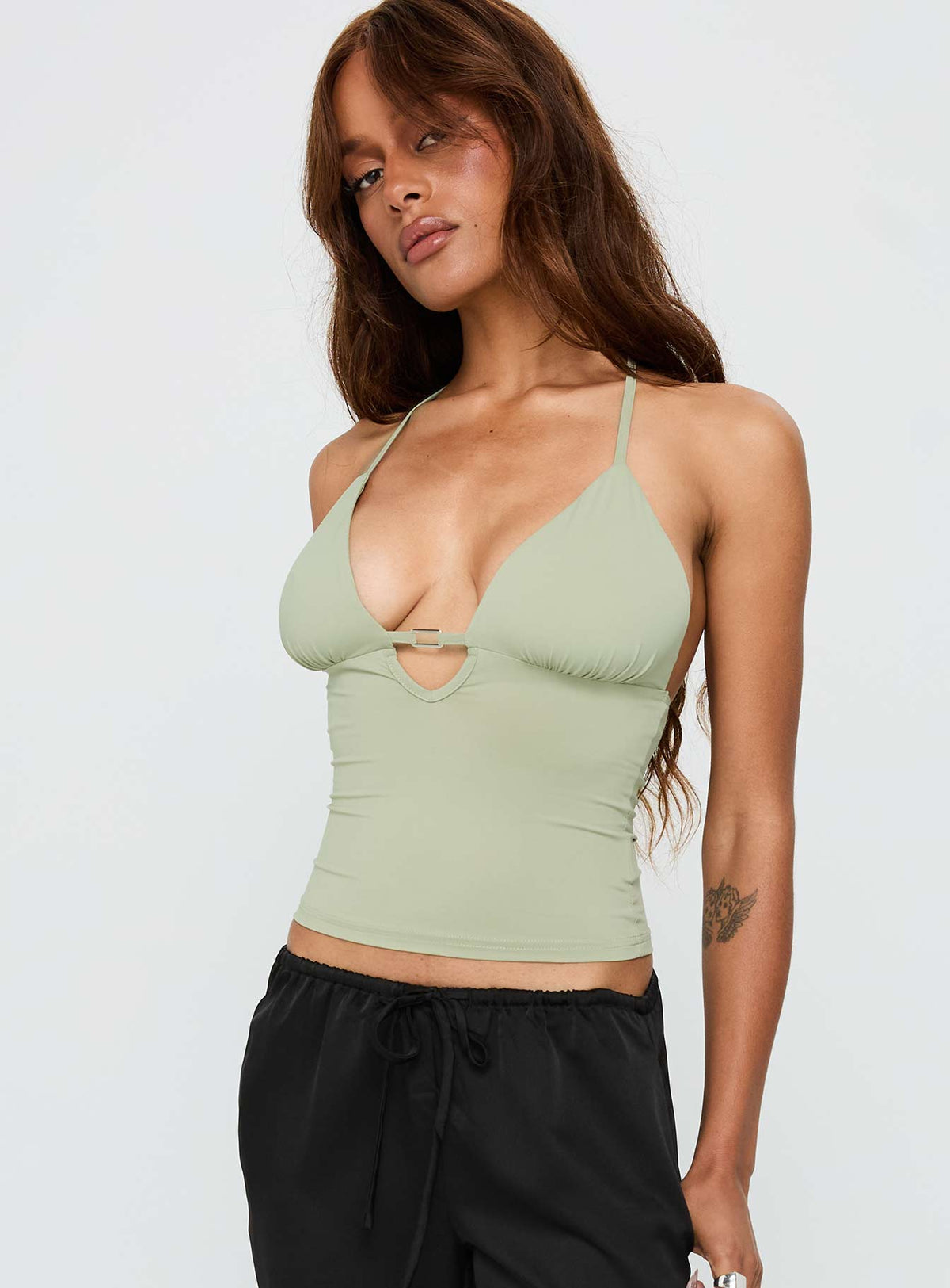 side view of model wearing Princess Polly Norwalk Plunge Neck Top Sage Sleeveless Plunger 