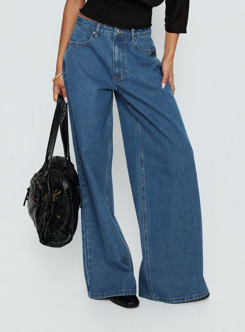 front view of model wearing Princess Polly Naylor Mid Rise Wide Leg Jeans Mid Blue Wash Mid Rise Jeans Jeans 