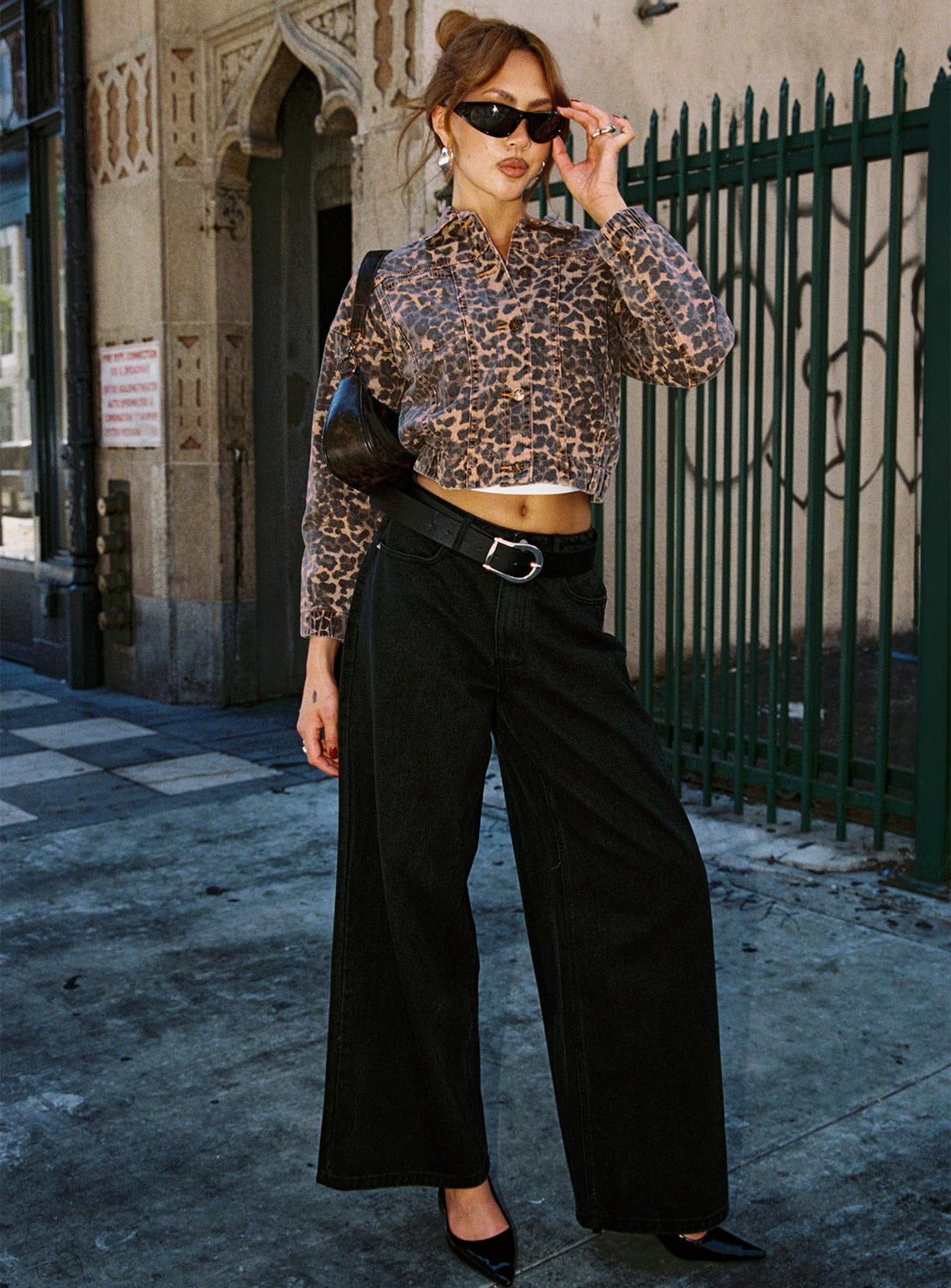 front view of model wearing Princess Polly Naylor Wide Leg Jeans Washed Black Denim Petite High Waisted 