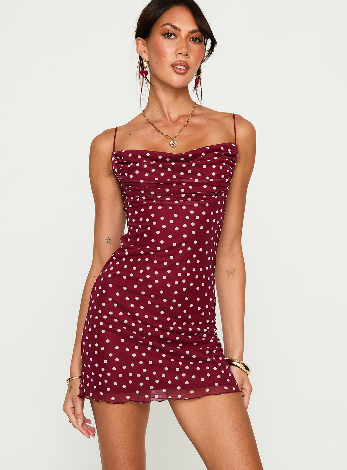 front view of model wearing Princess Polly Sugar Mini Dress Red Polka Cowl Neck 