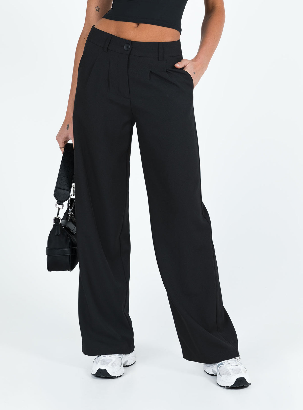 front view of model wearing Princess Polly Archie Low Rise Pants Black Petite Mid Rise Pants Pants 