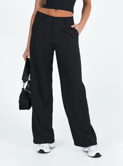 front view of model wearing Princess Polly Archie Low Rise Pants Black Petite Mid Rise Pants Pants 