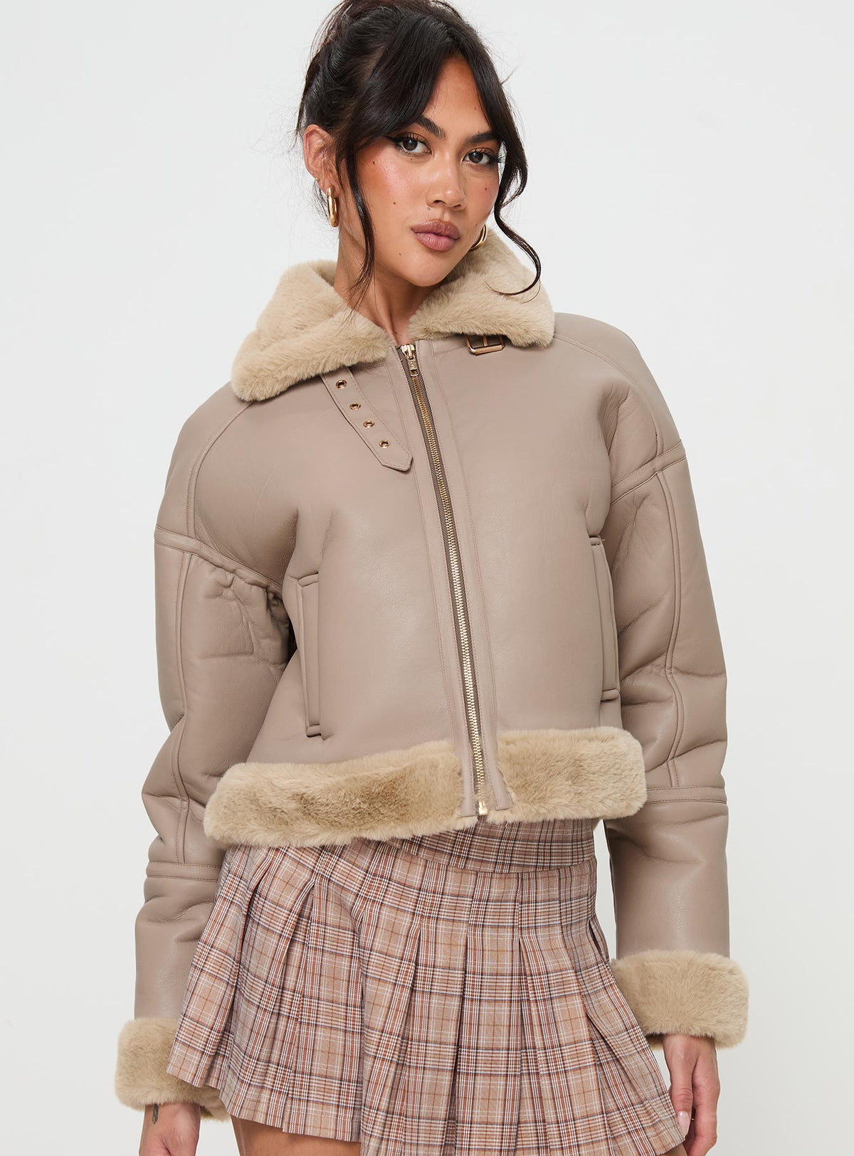 Beige Faux leather jacket Gold toned hardware, zip fastening down front, buckle fastening at neck, twin hip pockets