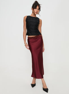   side view of model wearing Princess Polly The Charmaine Maxi Skirt Burgundy Midi Skirts Skirts 