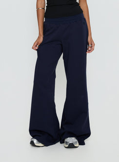 back view of model wearing Princess Polly Summits Flared Track Pants Navy Mid Rise Pants Pants 