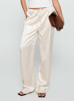side view of model wearing Princess Polly Soulstar Satin Pants Champagne Low Rise Pants 