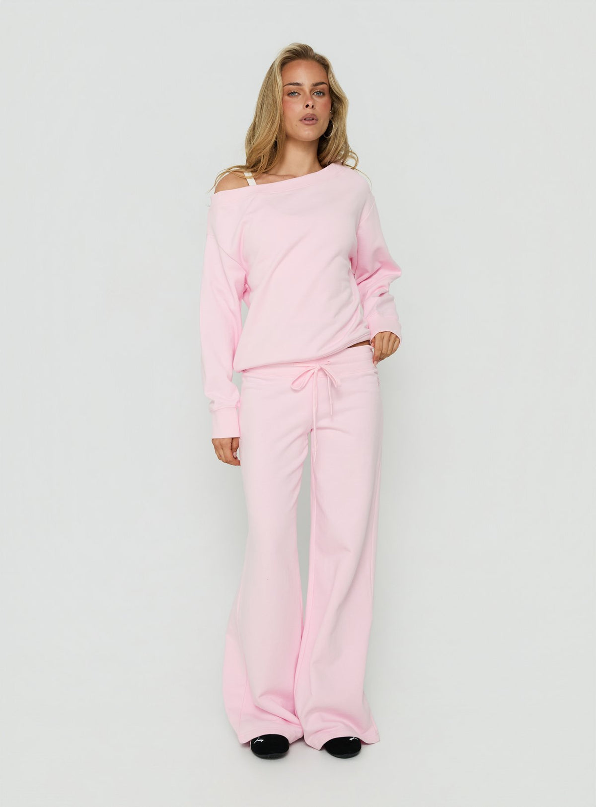 Featuring Dodie Wide Leg Pants Pink in womens regular pants with mid-rise front view of model wearing