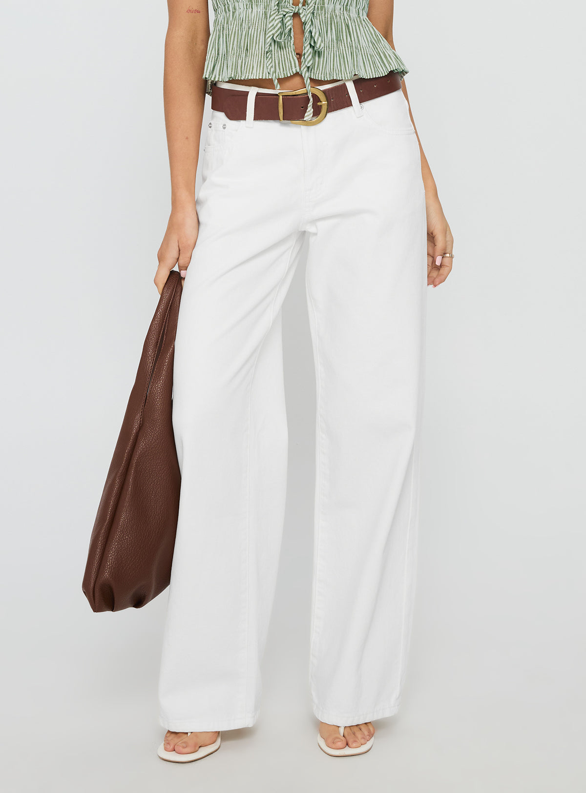 back view of model wearing Princess Polly Serenitia Mid Rise Relaxed Jeans White Wash High Rise Jeans Jeans 
