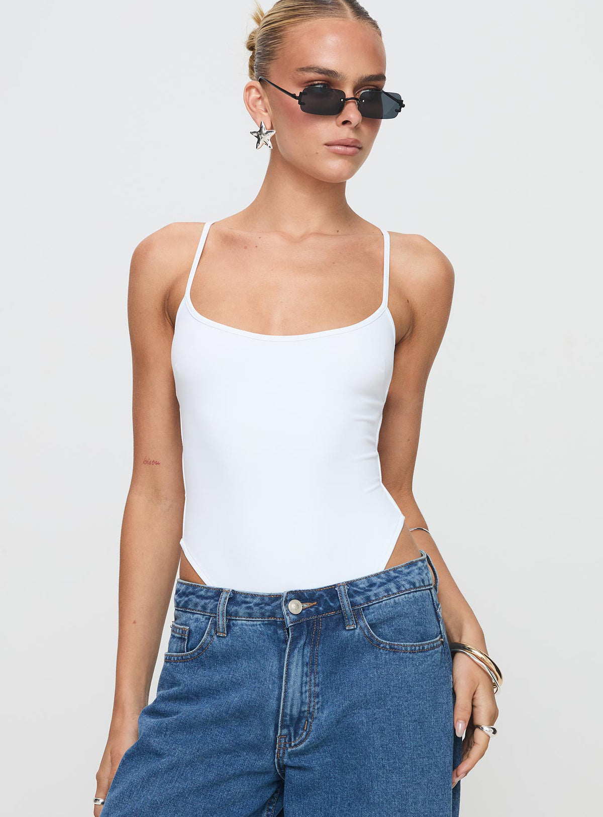 front view of model wearing Princess Polly All Tied Up Bodysuit White Tall Sleeveless Bodysuit 