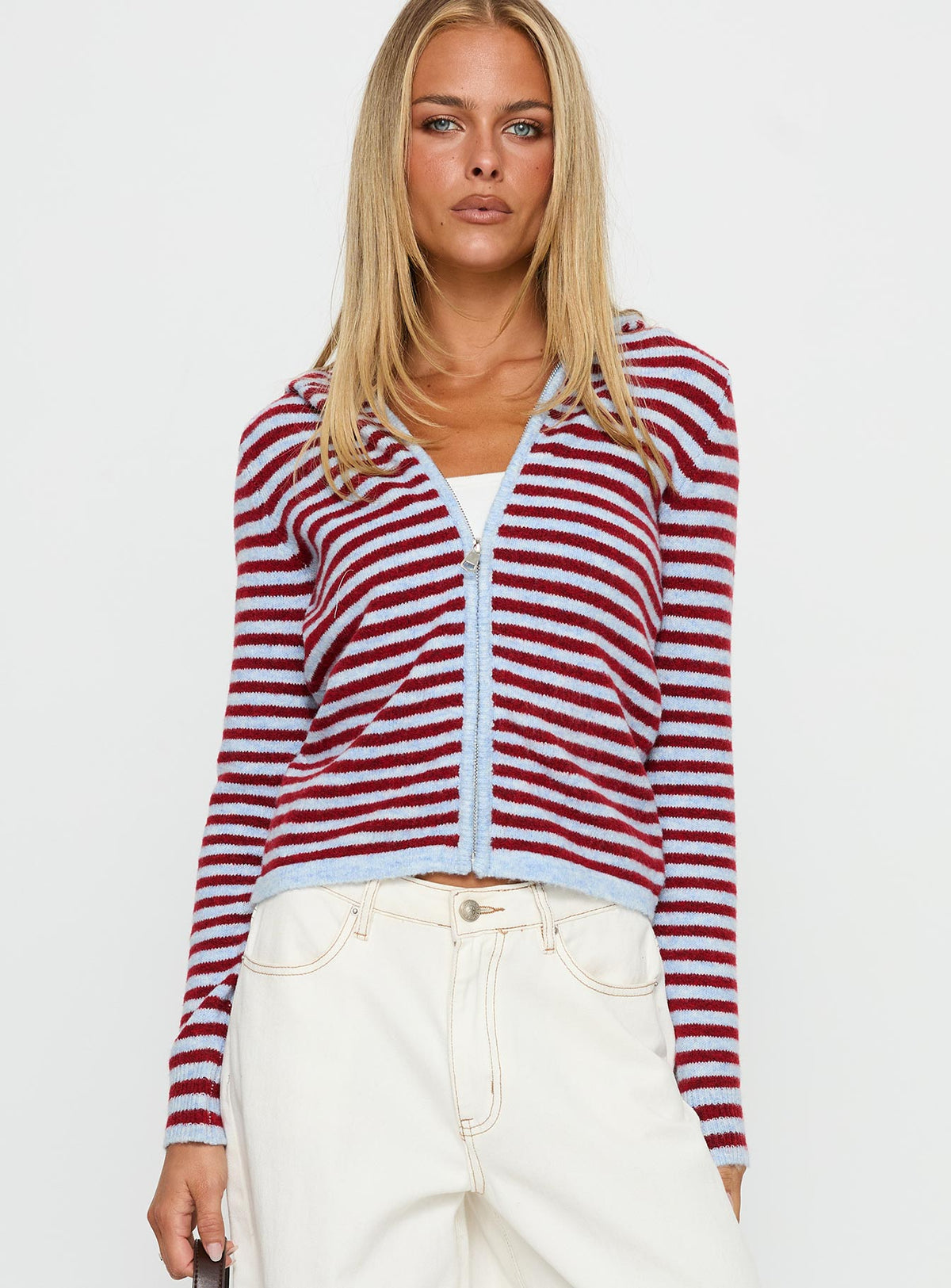 side view of model wearing Princess Polly Superstars Zip Through Hoodie Blue / Red Stripe cropped 