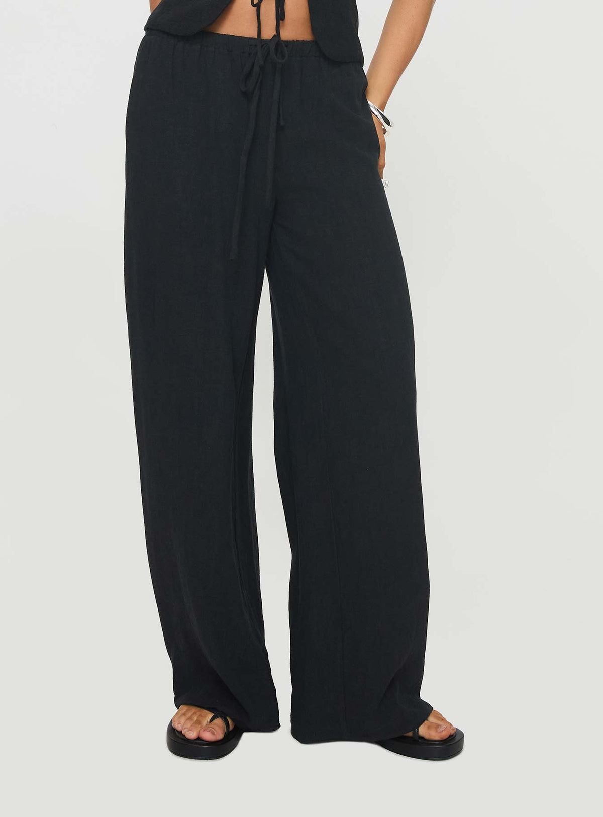 side view of model wearing Princess Polly Felipe Linen Blend Pants Black Pants 