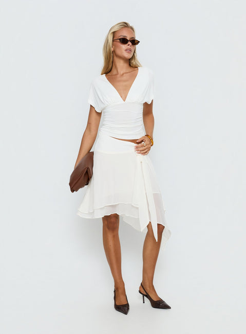 Crafted in ivory, the Ophella Tie Waist Chiffon Midi Skirt Cream womens-skirts with asymmetry and layered details product Princess Polly