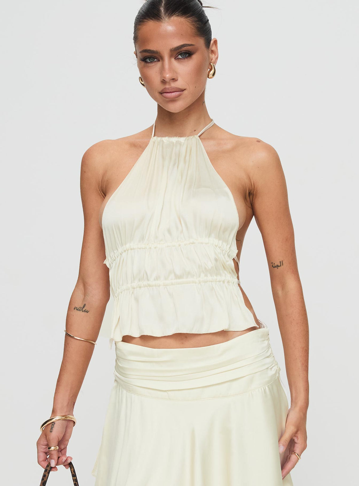 front view of model wearing Princess Polly Legacy Halter Top Ivory Sleeveless High Neck 