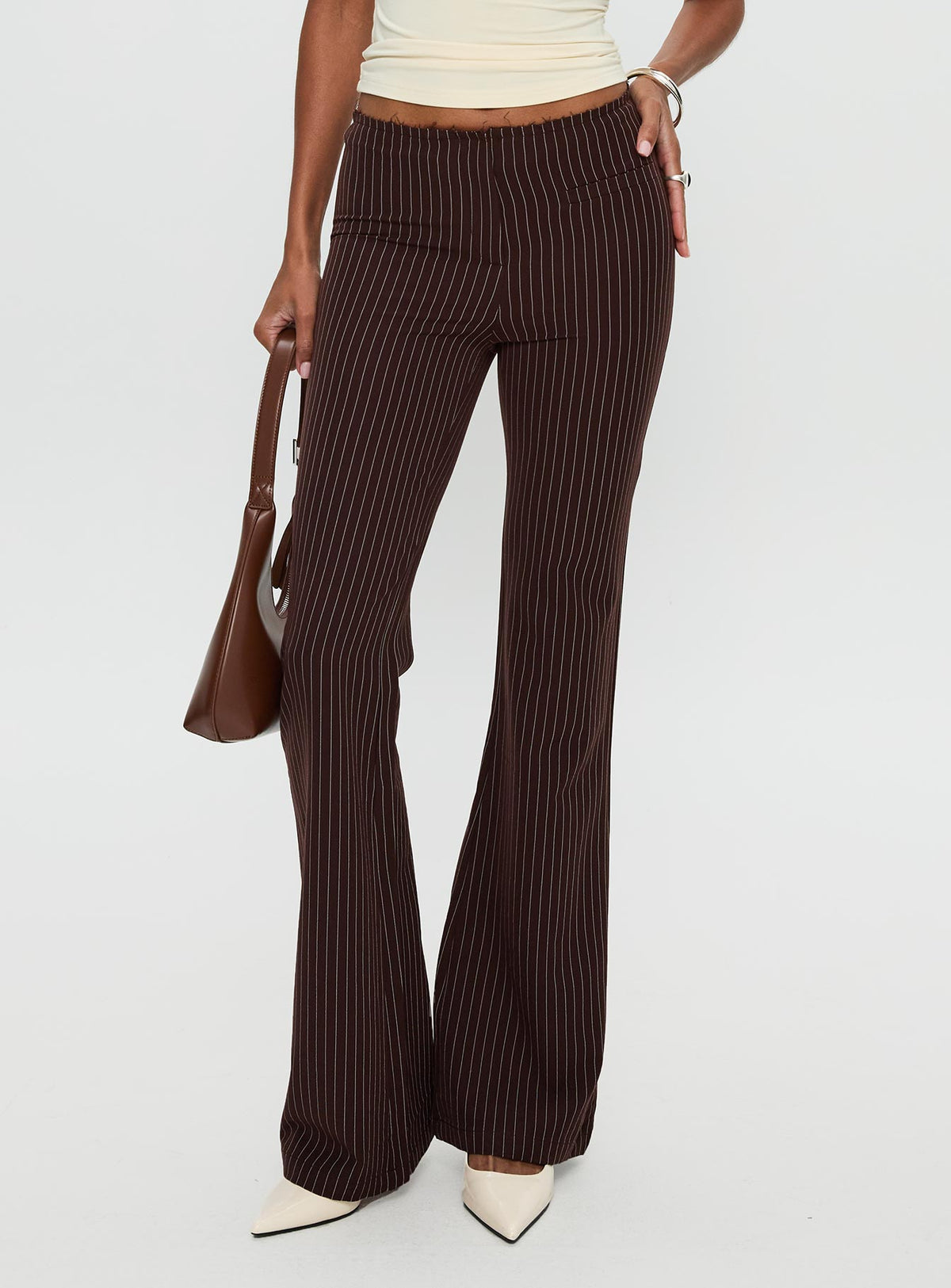 front view of model wearing Princess Polly Sportia Flare Pants Brown High Waisted Pants 