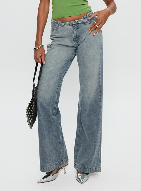 back view of model wearing Princess Polly Slow Ride Mid Rise Bootleg Belted Jeans Light Blue Mid Rise Jeans Jeans 
