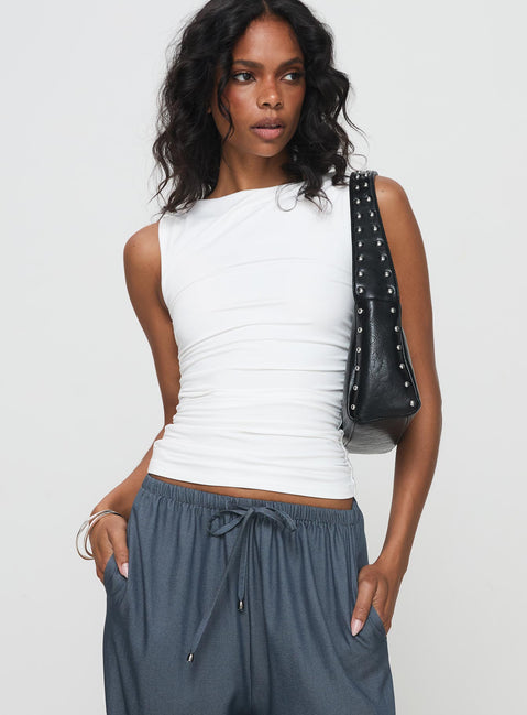 side view of model wearing Princess Polly Solani Top White Sleeveless High Neck 