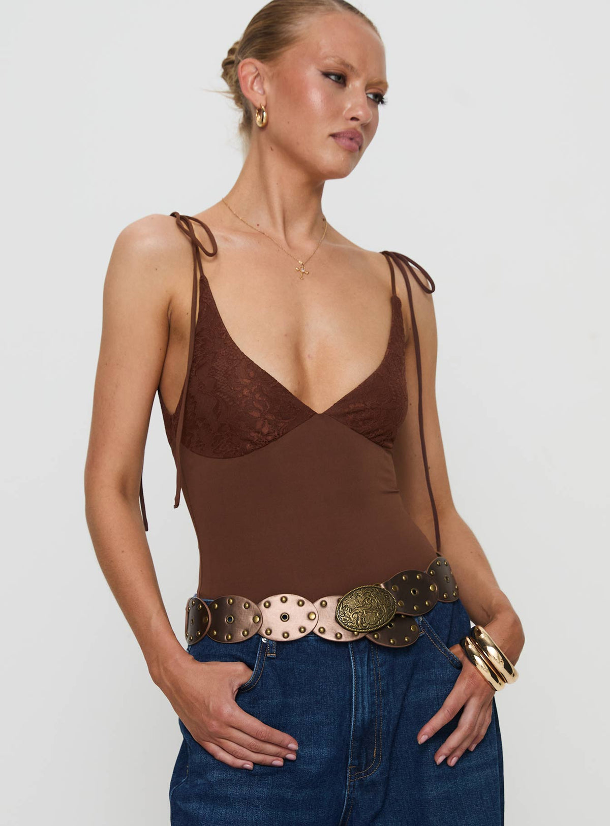 front view of model wearing Princess Polly Prichard Bodysuit Brown Sleeveless Bodysuit 