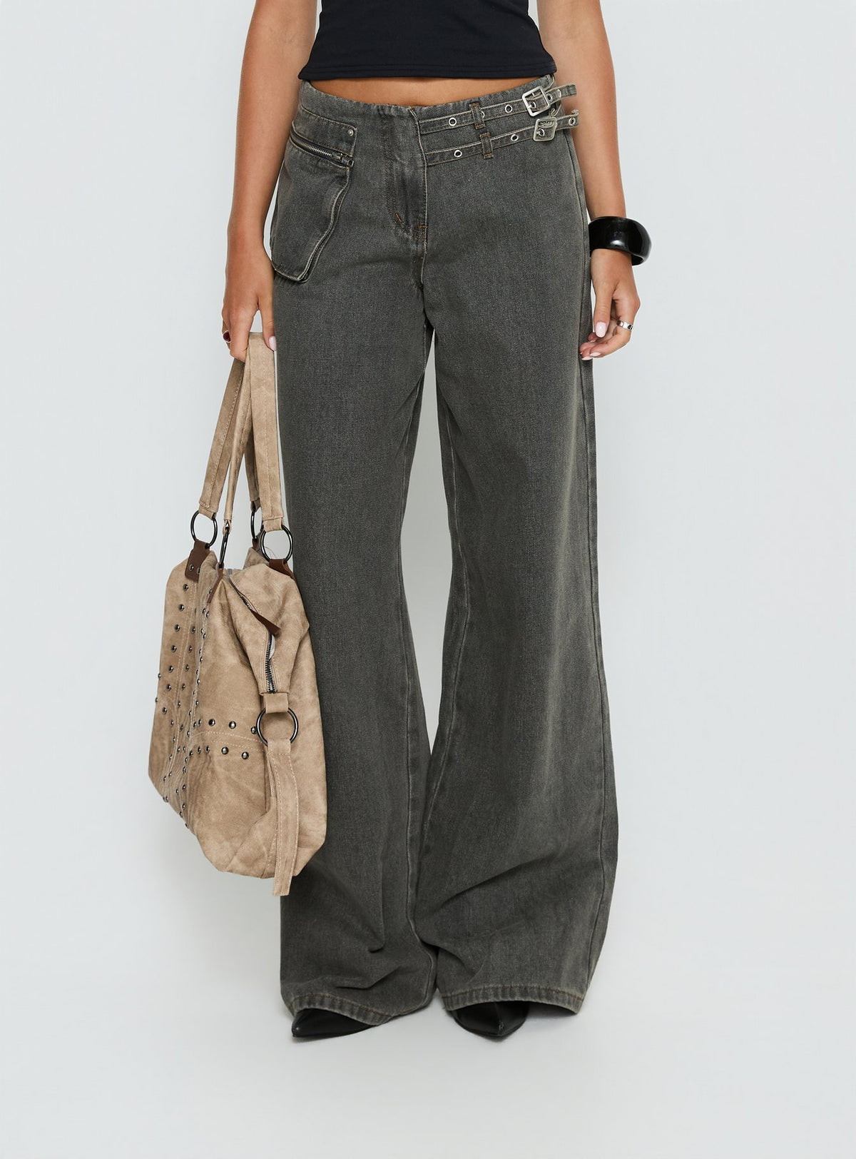 back view of model wearing Princess Polly Paltrow Mid Rise Wide Leg Cargo Jeans Washed Grey Mid Rise Jeans Jeans 
