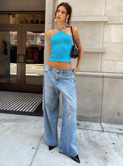 Showcasing the Naylor Mid Rise Wide Leg Jeans Light Wash Denim Tall in womens-jeans with mid-rise front view of model wearing Princess Polly