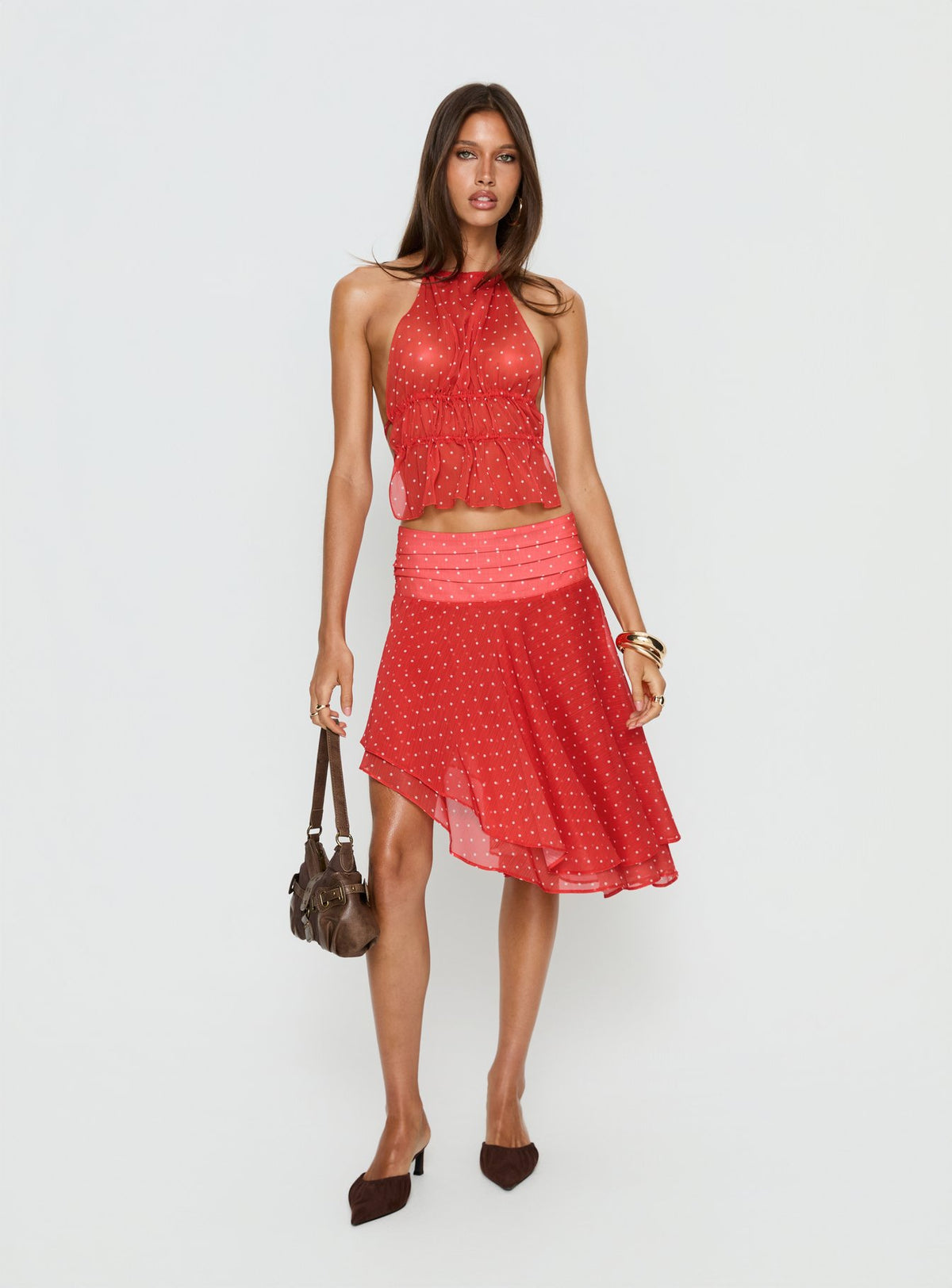   side view of model wearing Princess Polly Legacy Midi Skirt Tomato Polka Skirts 