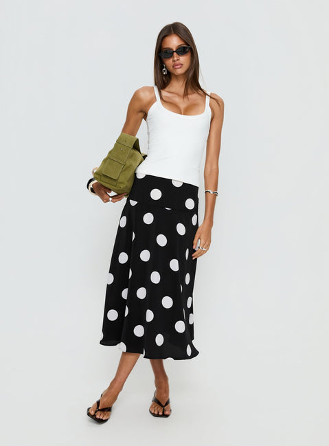   side view of model wearing Princess Polly Picture It Midi Skirt Black Polka Dot Midi Skirts Skirts 