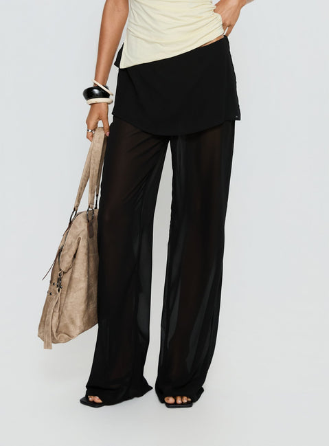 side view of model wearing Princess Polly Jaedon Chiffon Layered Pants Black Mid Rise Pants Pants 