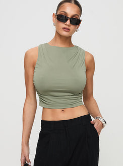 front view of model wearing Princess Polly Hold Em High Neck Top Green Sleeveless Crew Neck 