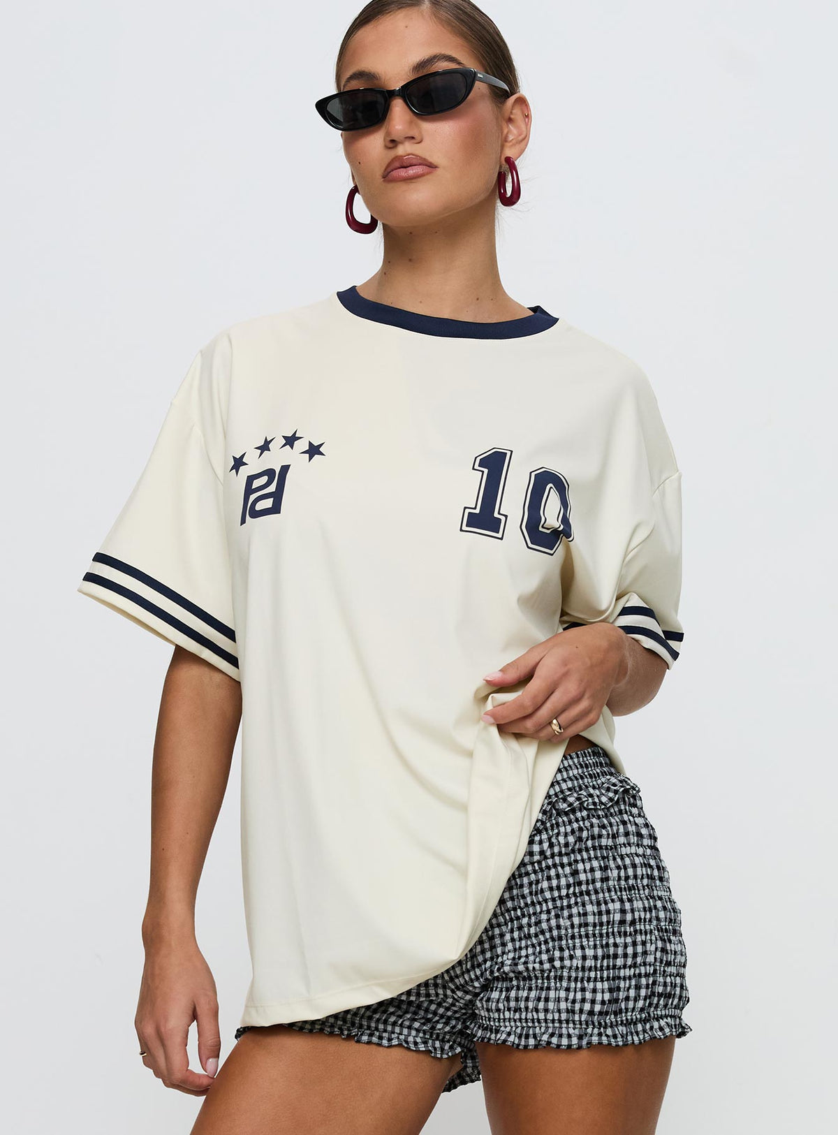 front view of model wearing Princess Polly Cornwall Football Jersey Cream Half Sleeves Crew Neck 