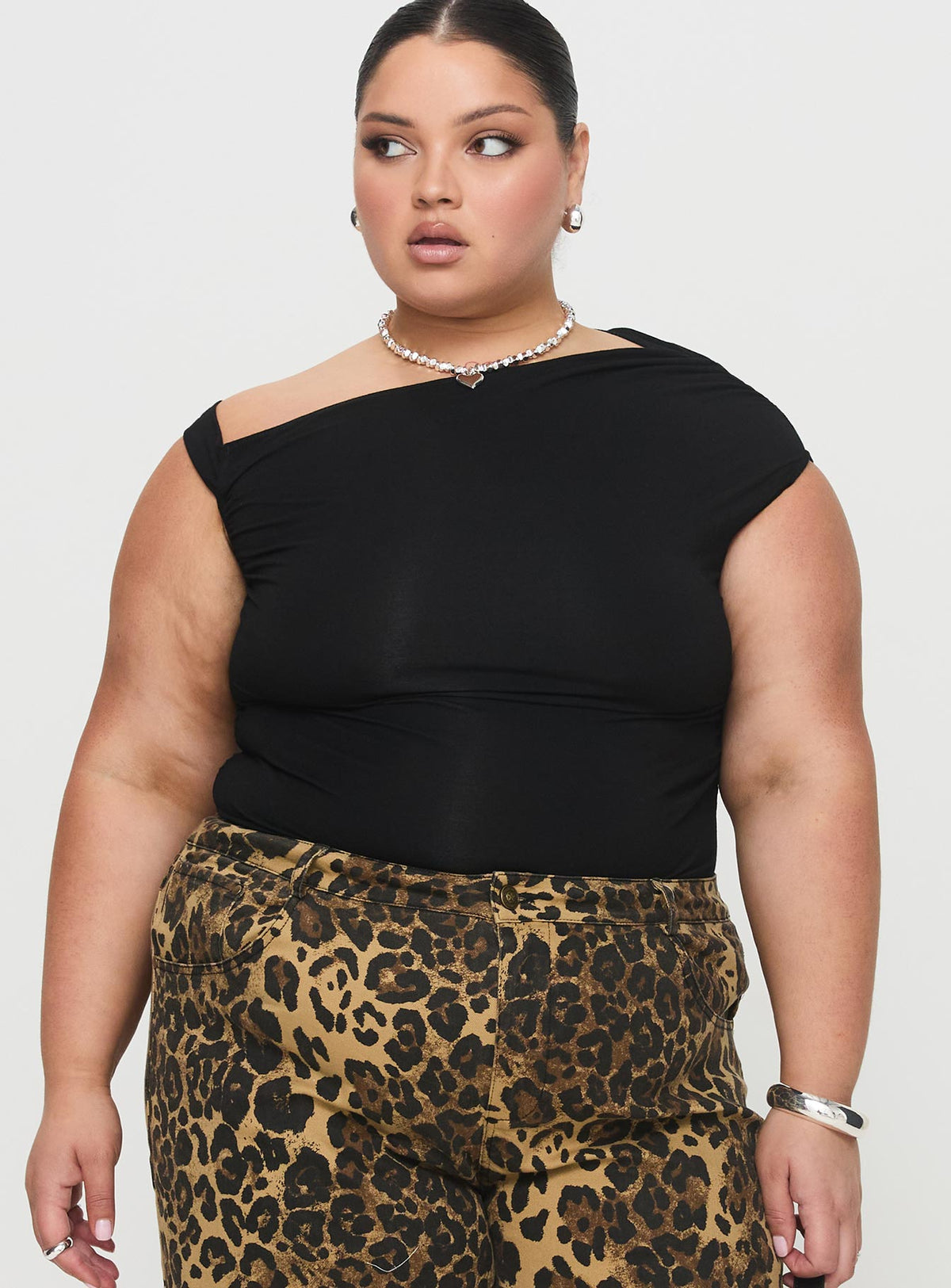 side view of model wearing Princess Polly Beller Bodysuit Black Curve Sleeveless Bodysuit 
