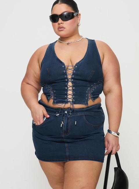 back view of model wearing Princess Polly Popular Low Rise Mini Skirt Mid Blue Wash Curve Mini Skirts Skirts 