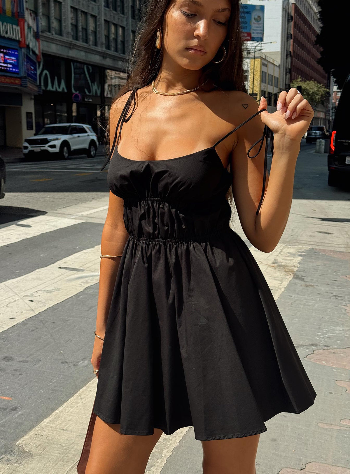 side view of model wearing Princess Polly Jacksonne Mini Dress Black Square Neck 