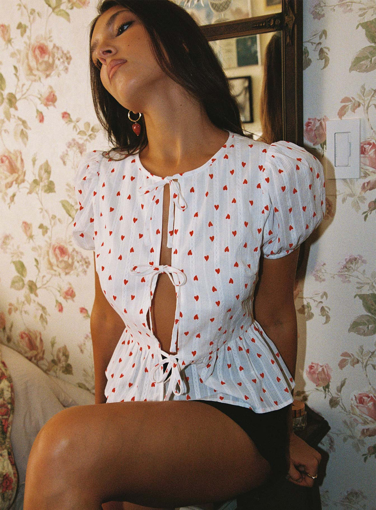 side view of model wearing Princess Polly Lucky In Love Bow Tie Top White / Red Short Sleeves Crew Neck 