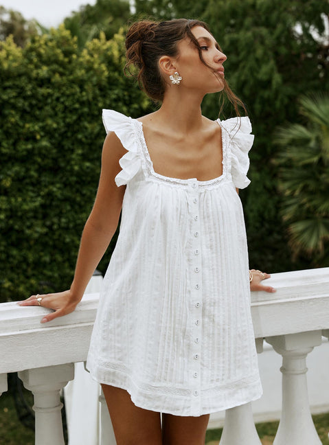 side view of model wearing Princess Polly Summerland Broiderie Mini Dress White Square Neck 