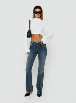 Showcasing Palaces Low Rise Ringspun Bootleg Jeans Dark Indigo womens-jeans side view of model wearing Princess Polly