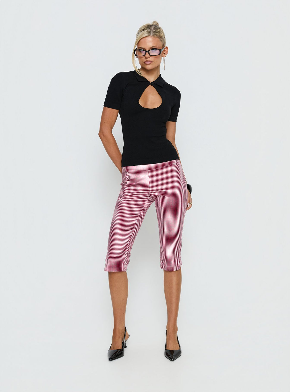 Showcasing Rossie Capri Pants Red Gingham womens-regular-pants with high-rise front view of model wearing