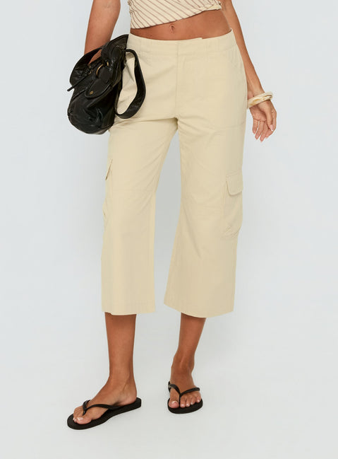 Featuring Indee Cropped Cargo Pants Beige Petite womens-regular-pants with high-rise detail view of model wearing Princess Polly