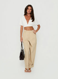Featuring the Kendall Pant Sand womens-regular-pants with high-rise pleated wide-leg design front view of model wearing