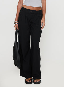 side view of model wearing Princess Polly Sallon Low Rise Pants Black Low Rise Pants Pants 