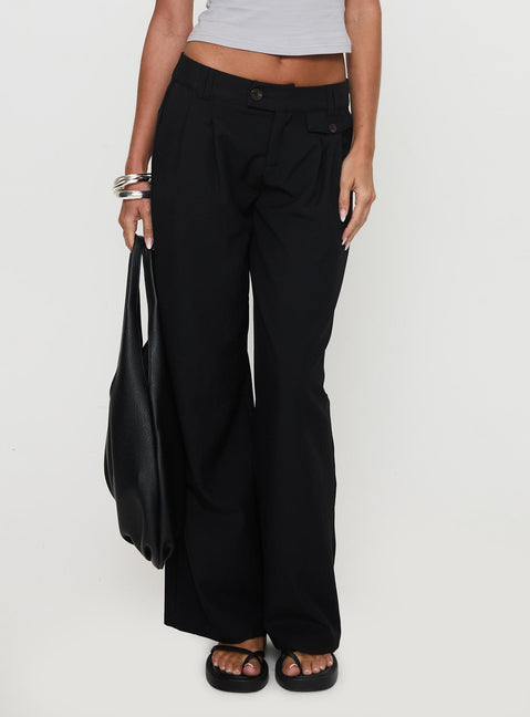 side view of model wearing Princess Polly Sallon Low Rise Pants Black Low Rise Pants Pants 