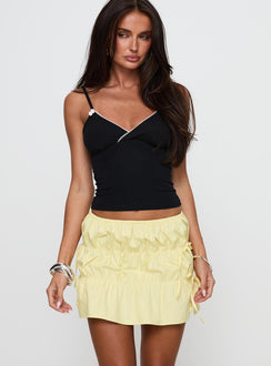   front view of model wearing Princess Polly Kiwie Ruched Mini Skirt Butter Yellow Mini Skirts Skirts 
